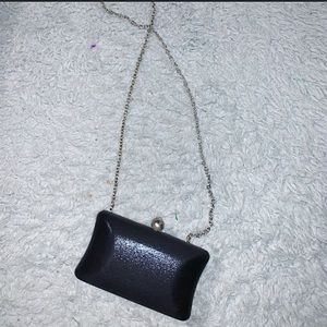 Hard shelled black clutch